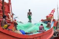 Fisherman Community preparing threading Netting tied knot commercial fishing net rope before throwing Fishing Tackle for catch of