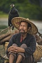 Fisherman with cormorants on the river Lijiang