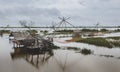 Fisherman cottage in swamp and square dip fish trap Royalty Free Stock Photo