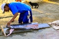 Fisherman cutting tuna, Acapulco, Mexico