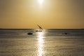 Fisherman dhow boat during sunset on Indian ocean in island Zanzibar, Tanzania, East Africa Royalty Free Stock Photo