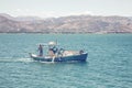 Fisherman driving traditional fishing boat 2