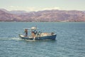 Fisherman driving traditional fishing boat 4