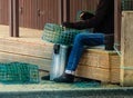 A fisherman on the edge of the shacks making his fishing gear Royalty Free Stock Photo