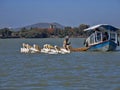 Fisherman feeds, Great White Pelican, Pelecanus onocrotalus, fishes on Lake Tana in Ethiopia