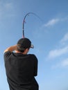 Fisherman fighting a fish Royalty Free Stock Photo