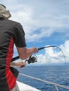 Fisherman fighting a fish Royalty Free Stock Photo