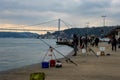 fisherman fishes on Bosphorus Istanbul on a Foggy sunrise