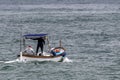 Fisherman fishing goiter boat in mediterranean sea Genoa