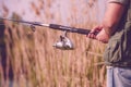 Fisherman fishing- Fisherman holding fishing rod