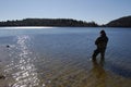 Fisherman fishing on a lake Royalty Free Stock Photo