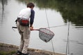 Fisherman with fishing line. Royalty Free Stock Photo