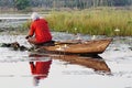 Fisherman in a boat on lake tengrela in burkina faso, africa