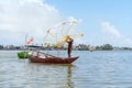 Fisherman Fishing Net on the boat at Cam thanh village. Landmark and popular for tourists attractions in Hoi An. Vietnam and