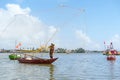 Fisherman Fishing Net on the boat at Cam thanh village. Landmark and popular for tourists attractions in Hoi An. Vietnam and