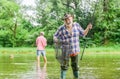 Fisherman with fishing rod. Activity and hobby. Fishing freshwater lake pond river. Bearded men catching fish. Mature Royalty Free Stock Photo