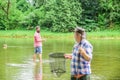 Fisherman with fishing rod. Activity and hobby. Fishing freshwater lake pond river. Bearded men catching fish. Mature Royalty Free Stock Photo