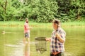 Fisherman with fishing rod. Activity and hobby. Fishing freshwater lake pond river. Bearded men catching fish. Mature Royalty Free Stock Photo