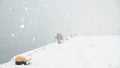 Fisherman fishing at the snowy pier