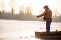 Fisherman fishing on sunny day Royalty Free Stock Photo