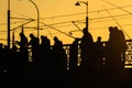 Fisherman fishing at sunset on the Galata Bridge in Istanbul Turkey Royalty Free Stock Photo