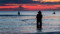 A fisherman is fishing at Sunset on Koh Rong, Cambodia