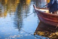 Fisherman fishing with wooden boat Royalty Free Stock Photo