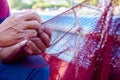 Fisherman is fixing the fish net Royalty Free Stock Photo