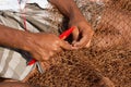 Fisherman fixing fishing nets