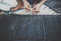 A fisherman fixing his fishing net