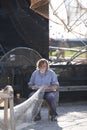 Fisherman fixing his nets