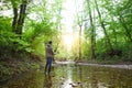 Fisherman with fly-fishing on mountain river Royalty Free Stock Photo