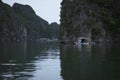 Fisherman in Ha Long Bay, Fish boat and House fishermen in wonderful landscape of Halong Bay, Vietnam Royalty Free Stock Photo