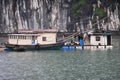 Fisherman in Ha Long Bay, Fish boat and House fisherman in wonderful landscape of Halong Bay, Vietnam