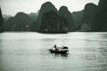 Fisherman in Ha Long Bay, Fish boat and House fishermen in wonderful landscape of Halong Bay Royalty Free Stock Photo