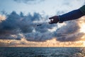 Fisherman arm, net and sunset. Royalty Free Stock Photo