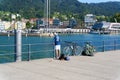 A fisherman in the harbor of Bregenz Royalty Free Stock Photo