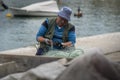 Fisherman Removing Fish From his Nets Royalty Free Stock Photo