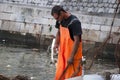 Fisherman in the harbour of the walled in the walled city of Dubrovnic in Croatia Royalty Free Stock Photo