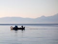 Fisherman Hauling in Net