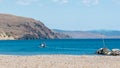 Fisherman heading out to sea in small fishing boat Royalty Free Stock Photo