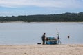Fisherman and his boat at the Lagoa de Obidos