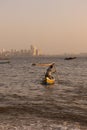 A fisherman on his boat and pushing it to sea Royalty Free Stock Photo