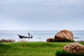 A Fisherman on his Boat Sailing in the Ocean Royalty Free Stock Photo