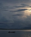 Fisherman on His Boat at Sunset. Fishermen Boat at Sunset