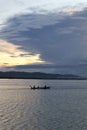 Fisherman on His Boat at Sunset. Fishermen Boat at Sunset