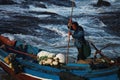 A fisherman with his boat Royalty Free Stock Photo