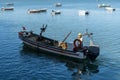 Fisherman on his boat during a working day Royalty Free Stock Photo