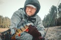 Fisherman holding bass in hand