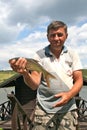 Fisherman holding a fish